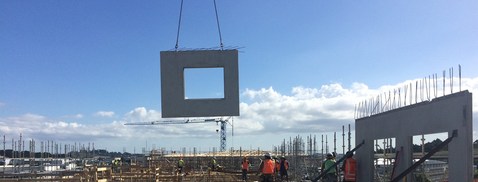 ZCAST site team installing precast panels with workers in PPE